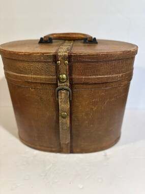 Vintage Oval Leather Hat Box with Brass Buckle and Burgundy Lining